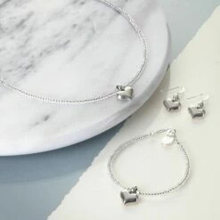 Carrie Elspeth Silver Heart Strings Necklace -gifts shop carrie elspeth silver heart strings range lifestyle 1 2 3 1